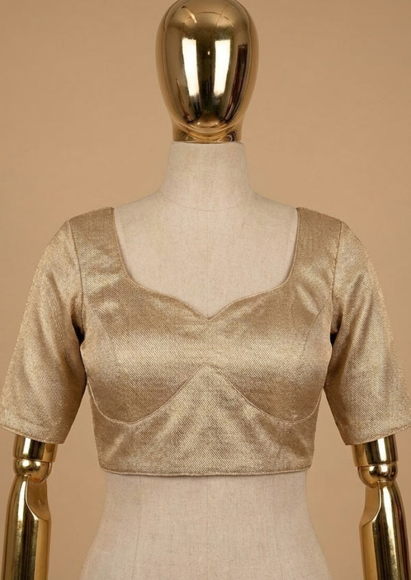 
Banarasi silk weave blouse, gold silk blouse, padded Banarasi blouse, back closure blouse, readymade silk blouse, festive saree blouse, wedding silk blouse, luxury Indian blouse.